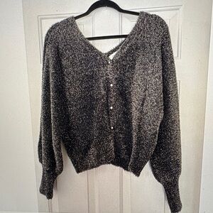 Elegant Black with Gold flecks and pearl buttons. Women's sweater size Large